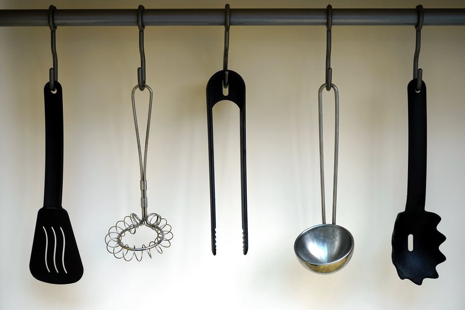 A selection of kitchen utensils hanging up